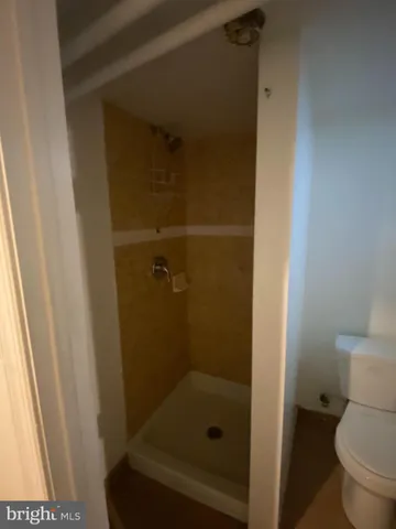 a view of front door with wooden floor and door