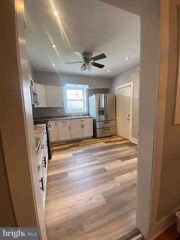 workspace with wooden floor and window