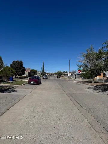 a view of street with parked cars