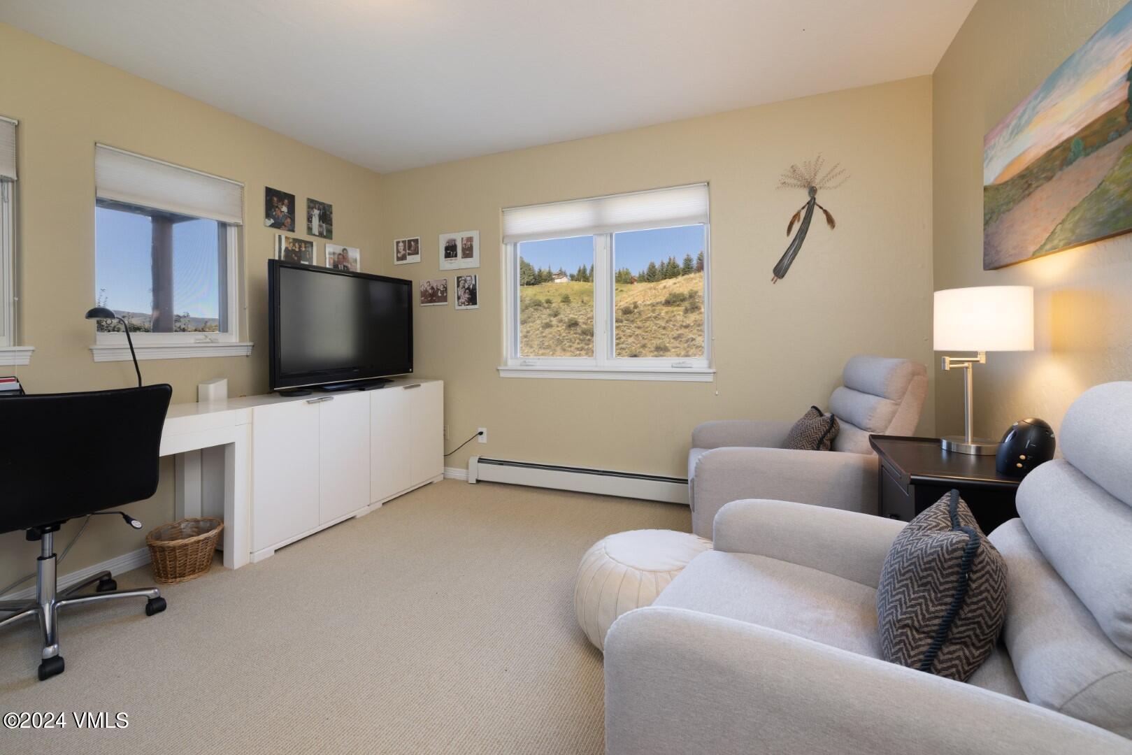 2492 Draw Spur, Unit D Avon, CO 81620 - Photo 13 of 22 a living room with furniture and a flat screen tv