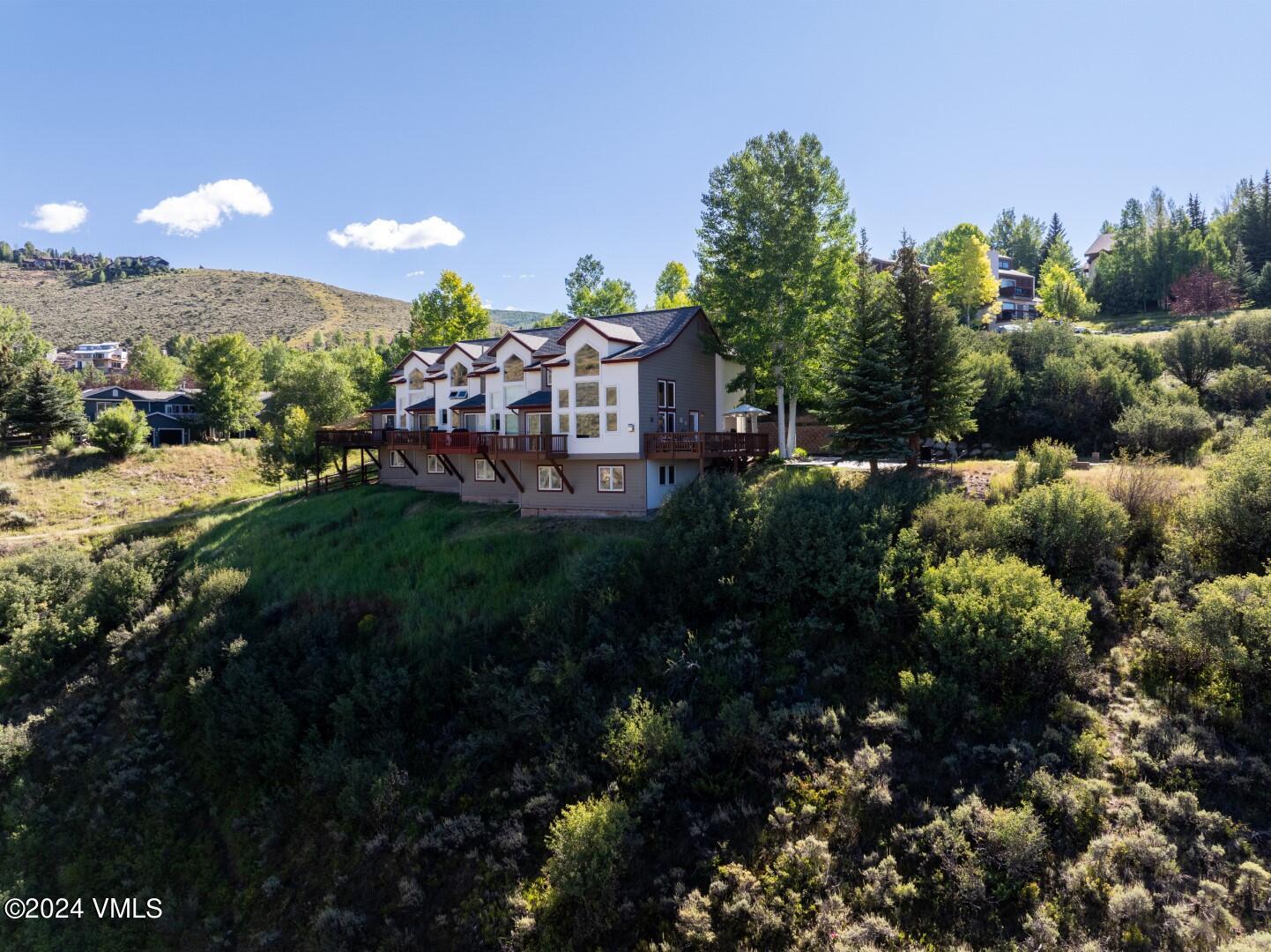 2492 Draw Spur, Unit D Avon, CO 81620 - Photo 20 of 22 a view of a garden with a house in a back yard