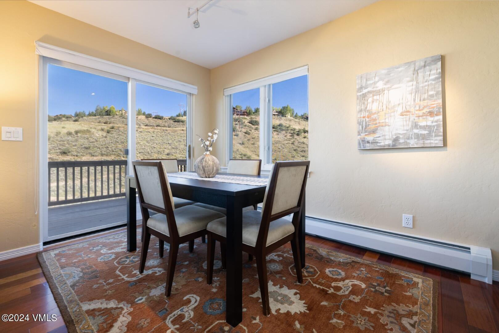 2492 Draw Spur, Unit D Avon, CO 81620 - Photo 5 of 22 a view of a dining room with furniture window and wooden floor