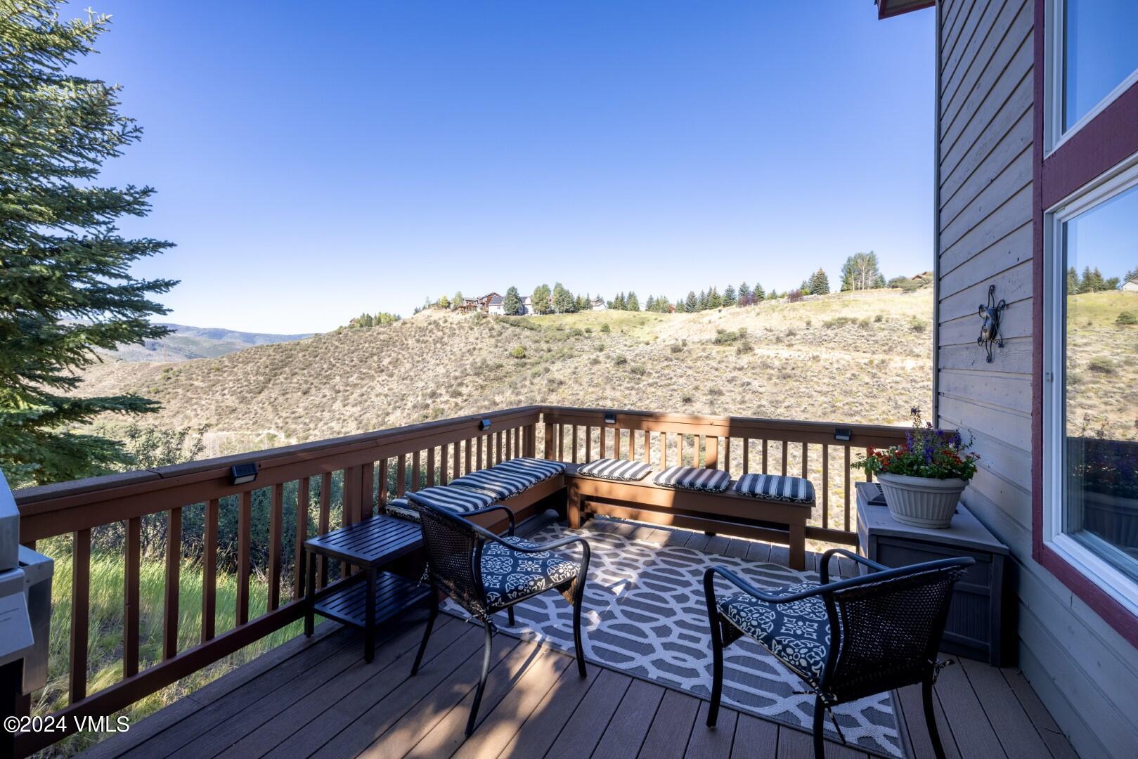 2492 Draw Spur, Unit D Avon, CO 81620 - Photo 6 of 22 a view of a balcony with wooden chairs