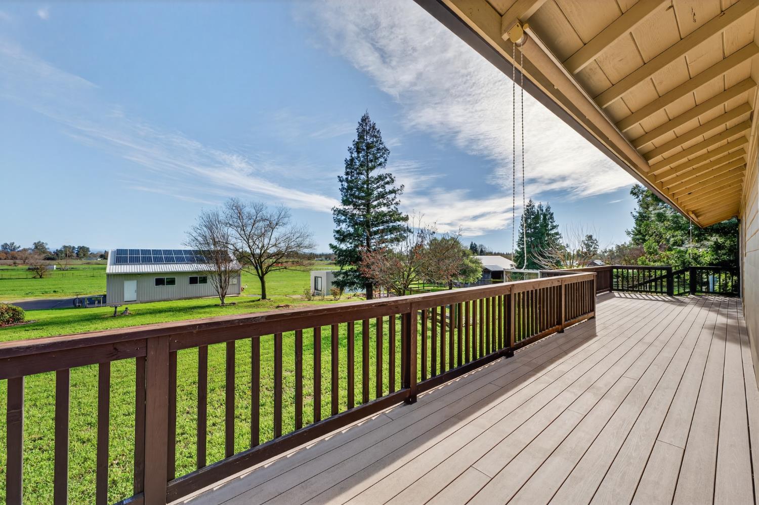 10919 Alta Mesa Road Wilton, CA 95693 - Photo 32 of 66 a view of a balcony with wooden floor