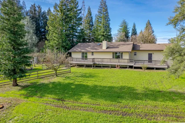 a backyard of a house with lots of green space