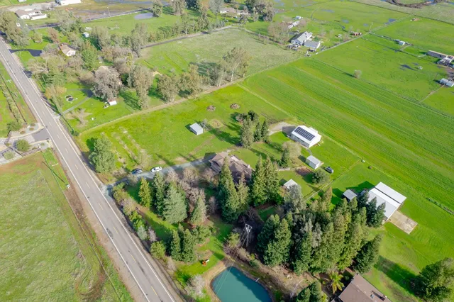 an aerial view of a houses with outdoor space