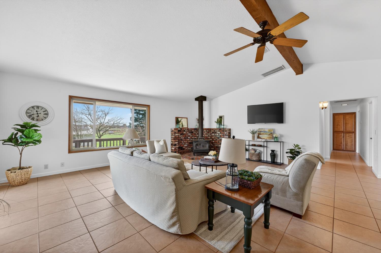 10919 Alta Mesa Road Wilton, CA 95693 - Photo 7 of 66 a living room with furniture and a flat screen tv