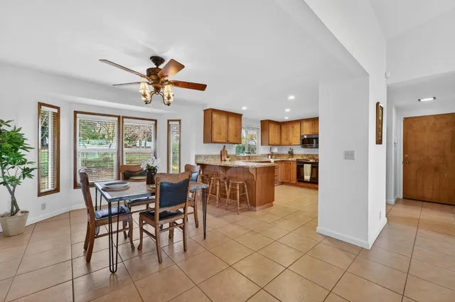 a view of a dining room and livingroom with furniture