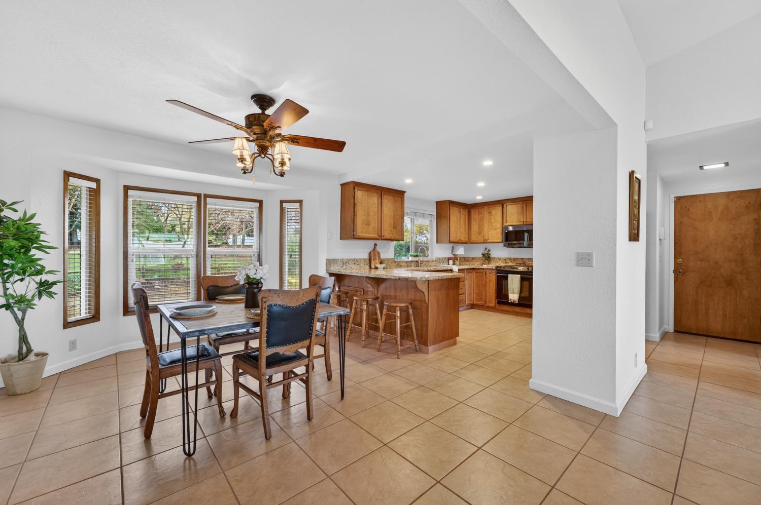 10919 Alta Mesa Road Wilton, CA 95693 - Photo 10 of 66 a view of a dining room and livingroom with furniture