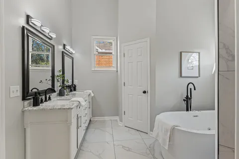 a bathroom with a sink toilet and tub