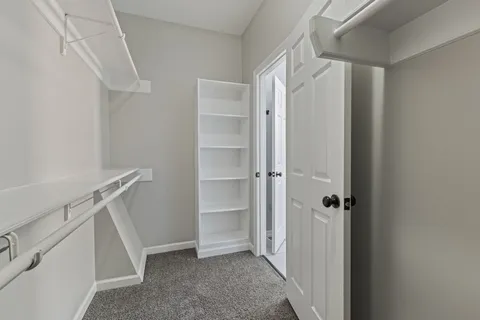 a view of an empty walk in closet