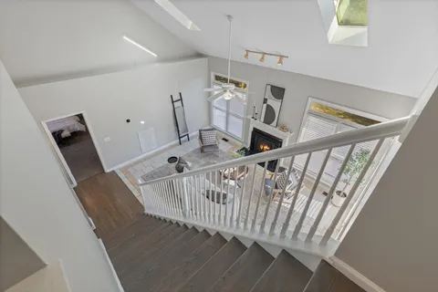 a view of entryway with furniture and wooden floor