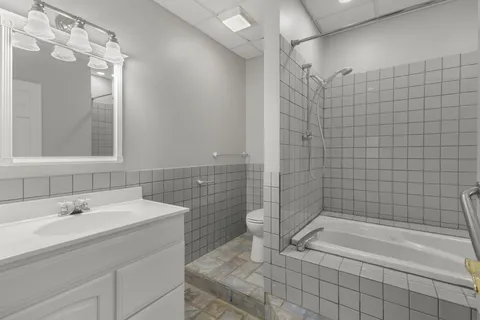 a bathroom with a bathtub and shower