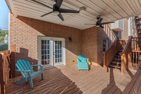 a view of a deck with wooden floor and outdoor seating