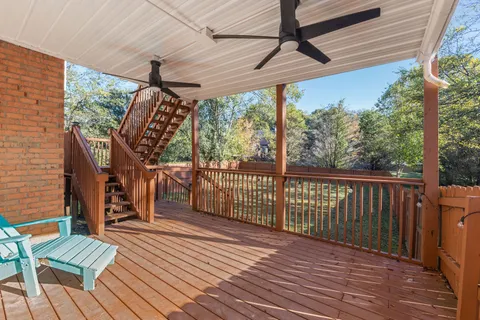 a view of a porch with wooden floor