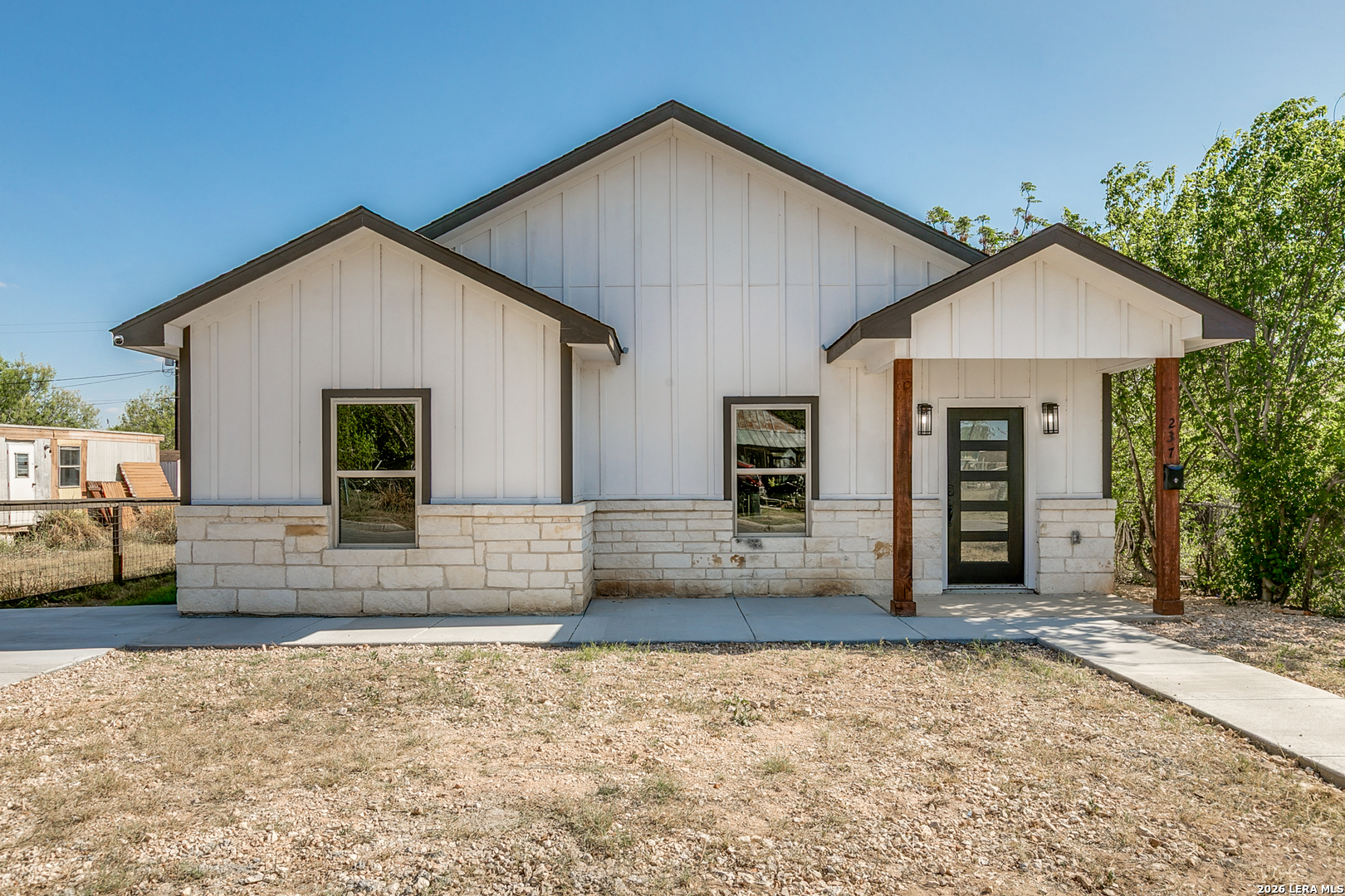 237 Avenue D Poteet, TX 78065 - Photo 1 of 27 a view of a house with a patio