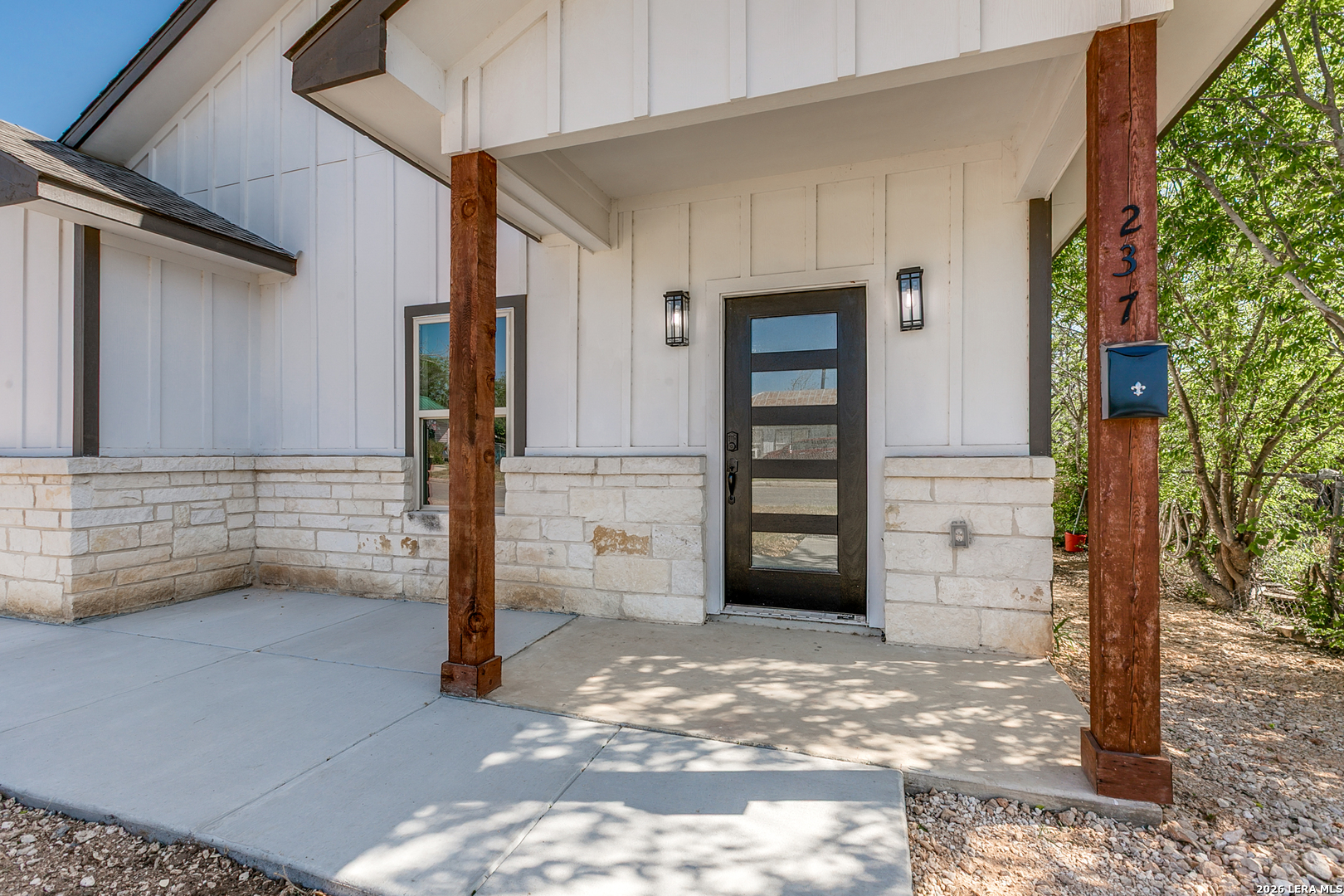 237 Avenue D Poteet, TX 78065 - Photo 2 of 27 a view of a wooden door of the house