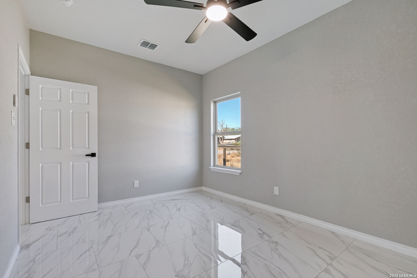 237 Avenue D Poteet, TX 78065 - Photo 21 of 27 a view of an empty room with a window