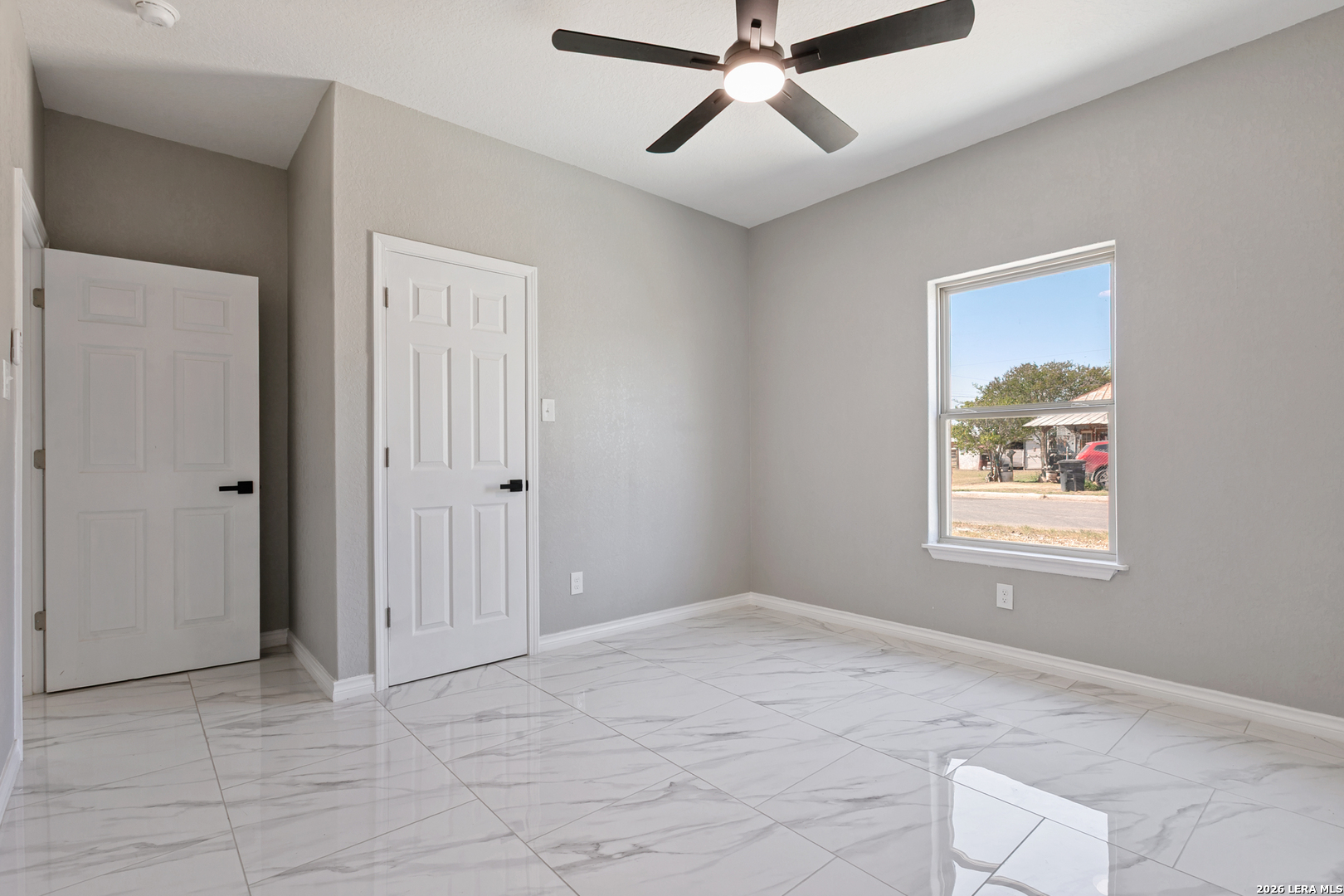 237 Avenue D Poteet, TX 78065 - Photo 22 of 27 a view of an empty room with a window