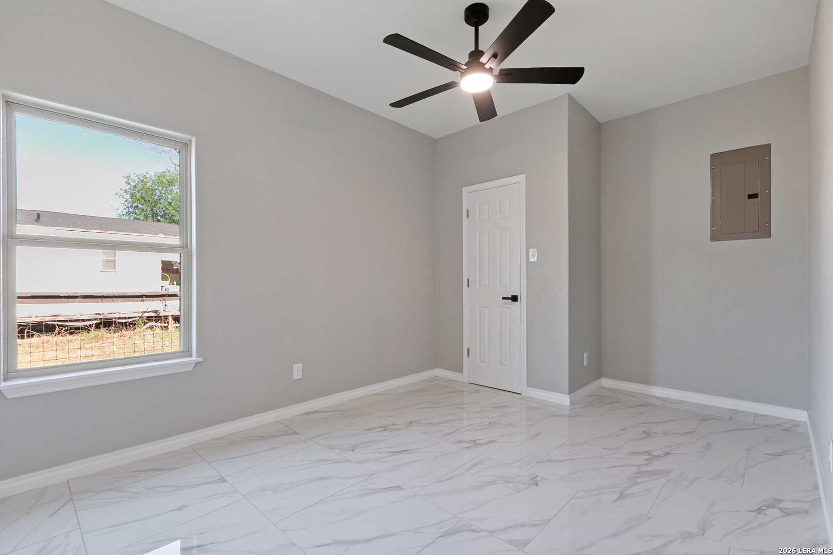 237 Avenue D Poteet, TX 78065 - Photo 23 of 27 a view of an empty room with a window