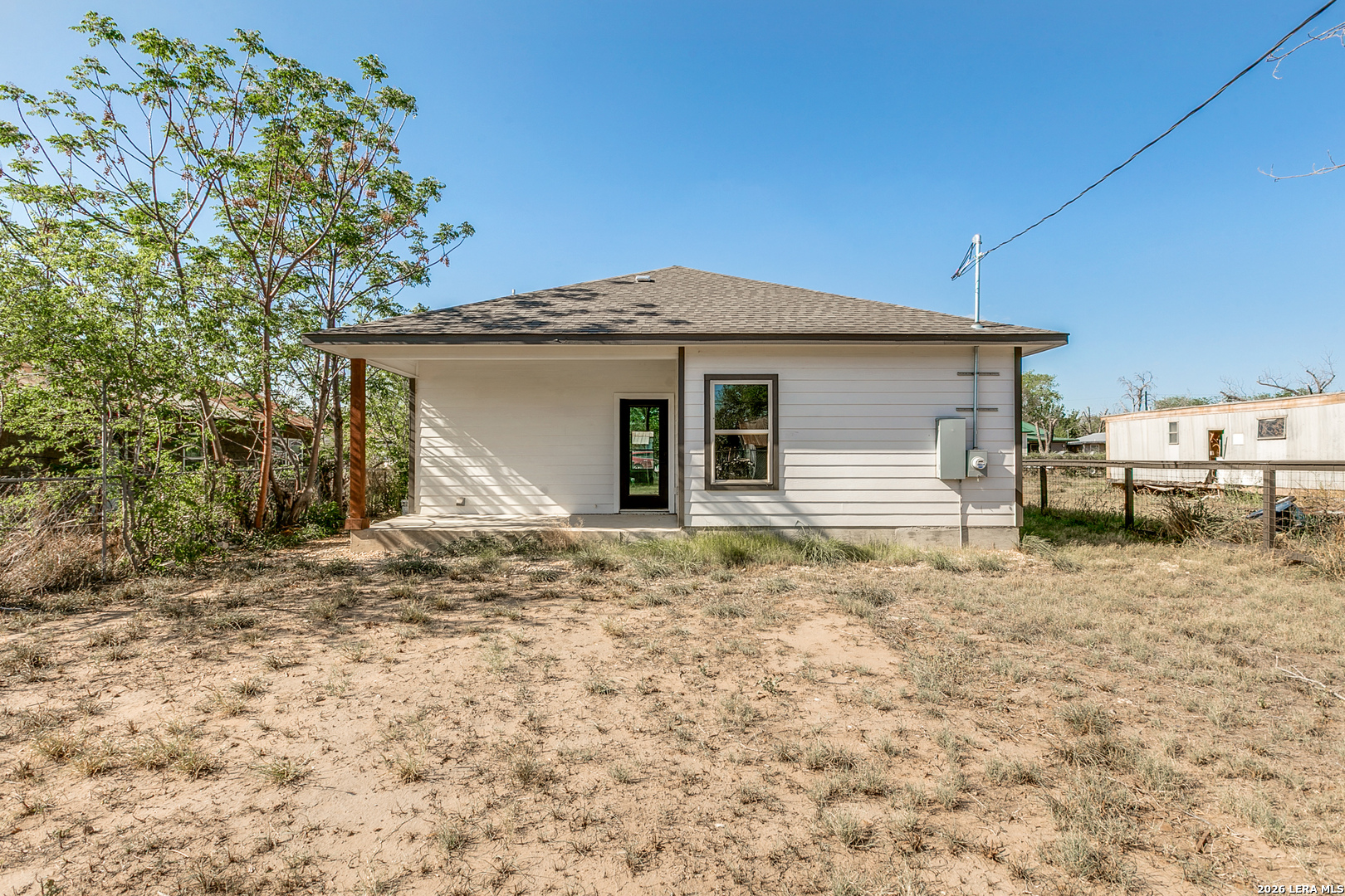 237 Avenue D Poteet, TX 78065 - Photo 27 of 27 a view of a house with a yard