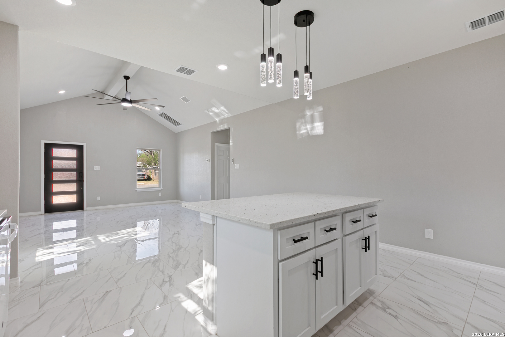 237 Avenue D Poteet, TX 78065 - Photo 8 of 27 a view of a hallway with cabinet and chandelier