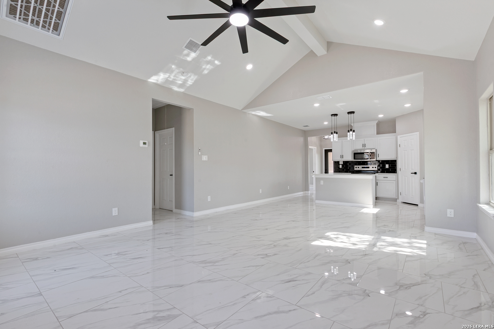 237 Avenue D Poteet, TX 78065 - Photo 10 of 27 a view of a livingroom with a kitchen