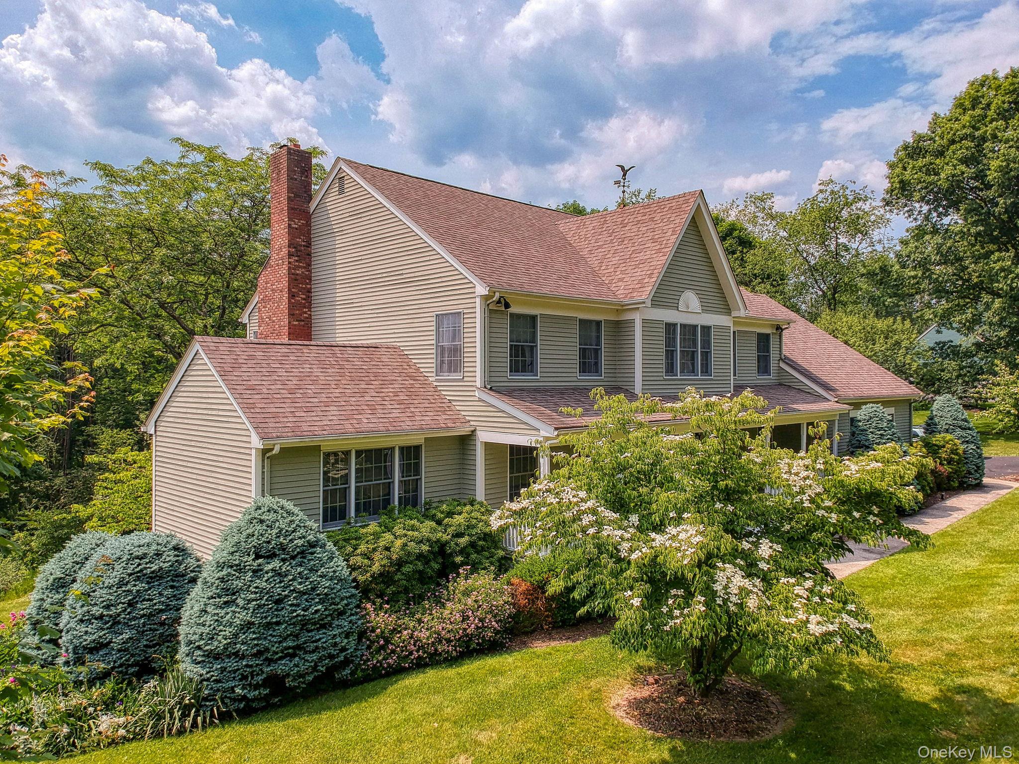 View of front of home with mature landscaping