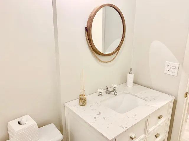 a bathroom with a sink and a mirror