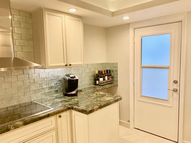 a kitchen with a sink and a refrigerator