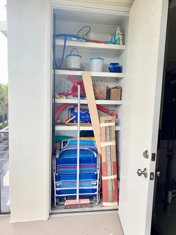 a kitchen with stainless steel appliances granite countertop a refrigerator sink and white cabinets