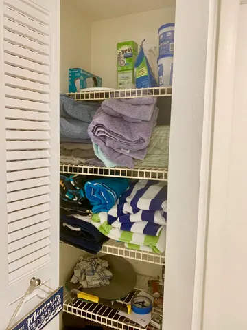 a view of a patio with a table and chairs