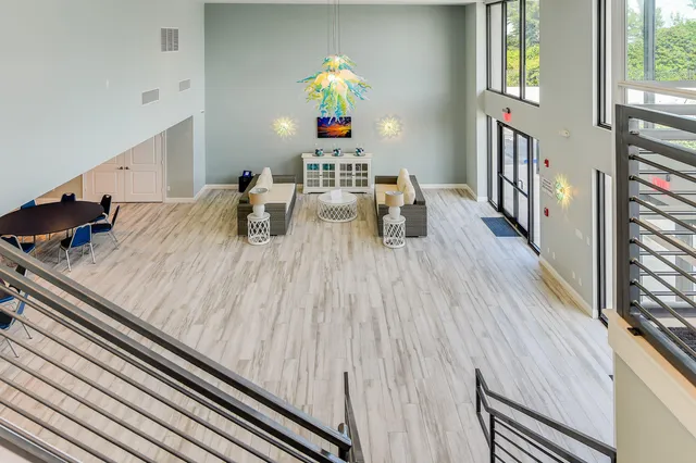 a view of swimming pool with outdoor seating and plants