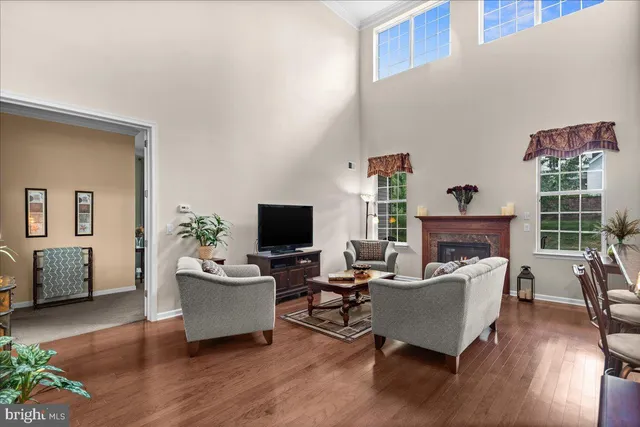 a living room with fireplace furniture and a flat screen tv