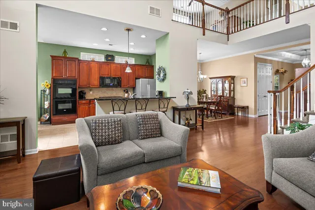a kitchen with stainless steel appliances granite countertop a sink and cabinets