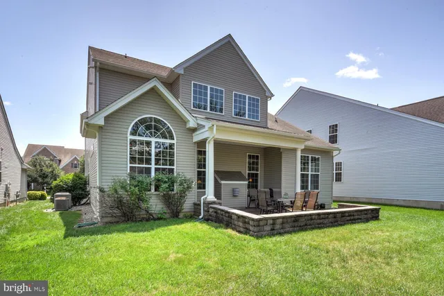 a view of a swimming pool with an outdoor seating