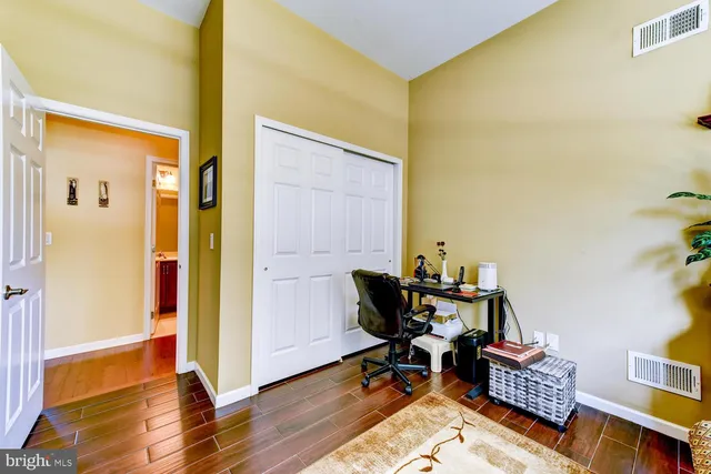 a bathroom with a sink vanity and a mirror