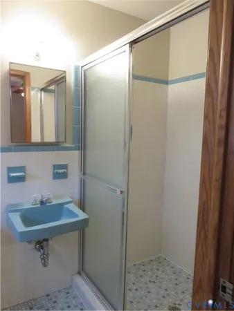 a bathroom with a sink and mirror