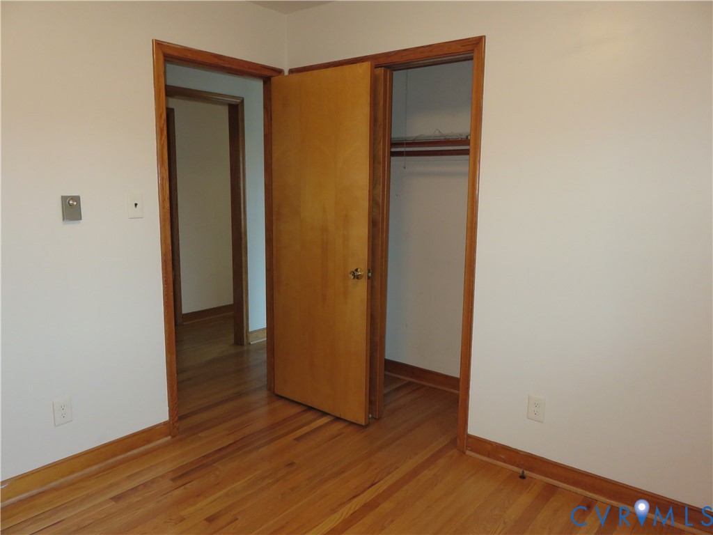 6729 Cold Harbor Road Mechanicsville, VA 23111 - Photo 17 of 22 a view of an empty room with wooden floor and closet