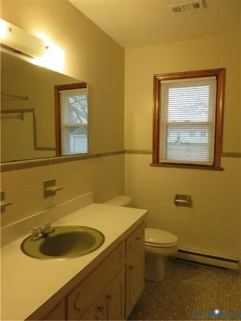a bathroom with a sink and a toilet