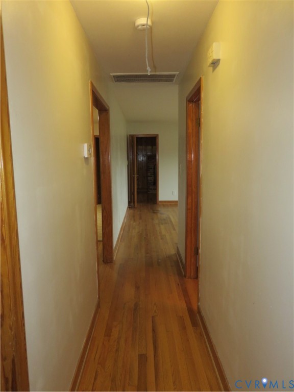 6729 Cold Harbor Road Mechanicsville, VA 23111 - Photo 9 of 22 a view of a hallway with wooden floor