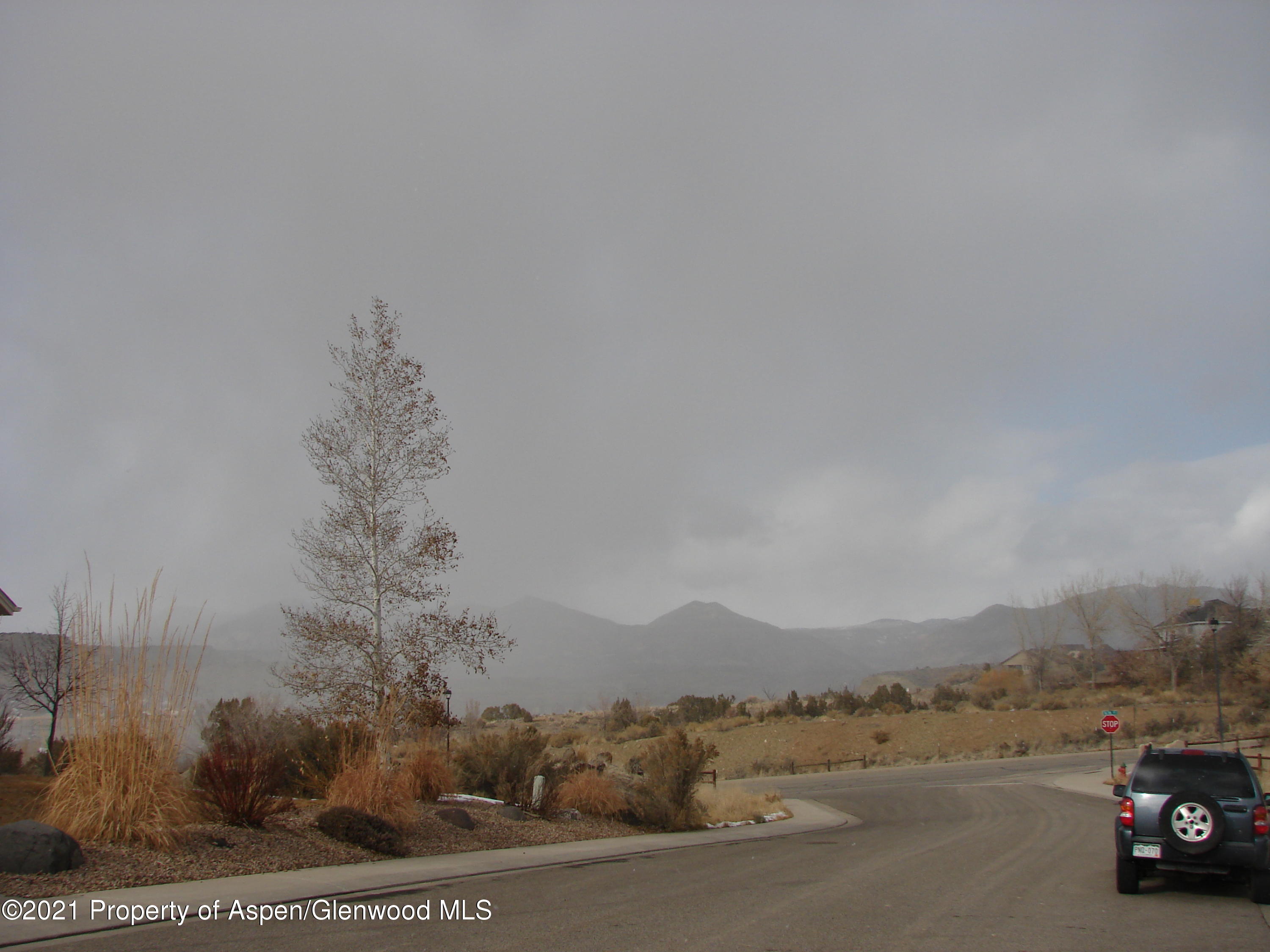 1550 Rifle Heights Drive Rifle, CO 81650 - Photo 1 of 2 a view of car parked on road with trees
