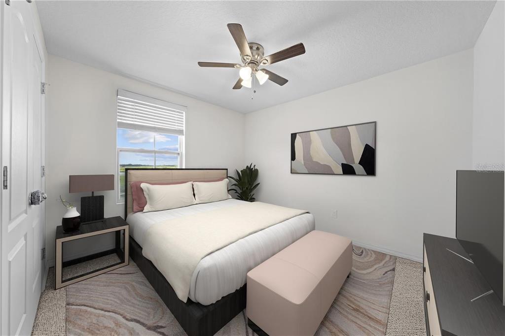 1619 Reflection Cove St. Cloud, FL 34771 - Photo 11 of 54 a bedroom with a bed and a chandelier