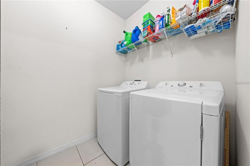 1619 Reflection Cove St. Cloud, FL 34771 - Photo 24 of 54 a utility room with dryer and washer