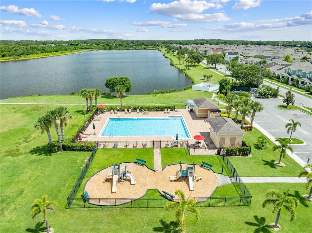 1619 Reflection Cove St. Cloud, FL 34771 - Photo 26 of 54 an aerial view of a house with outdoor space swimming pool and lake view