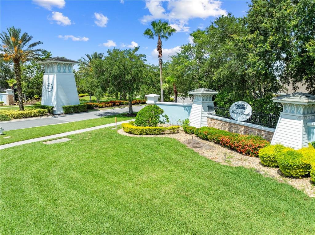 1619 Reflection Cove St. Cloud, FL 34771 - Photo 35 of 54 a view of a house with backyard and sitting area