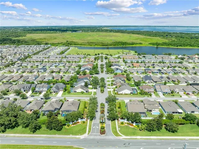 a front view of a house with a yard and outdoor seating