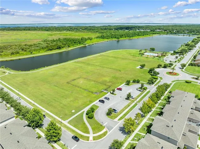 an aerial view of a house with a yard