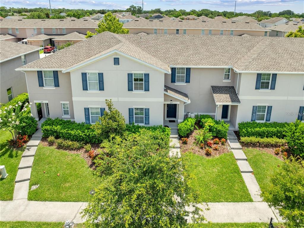 1619 Reflection Cove St. Cloud, FL 34771 - Photo 51 of 54 an aerial view of a house with a yard