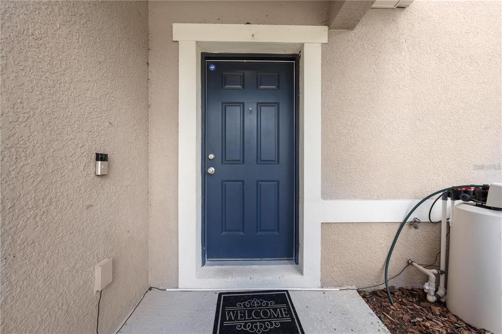 1619 Reflection Cove St. Cloud, FL 34771 - Photo 54 of 54 a view of a hallway with a door and a mirror